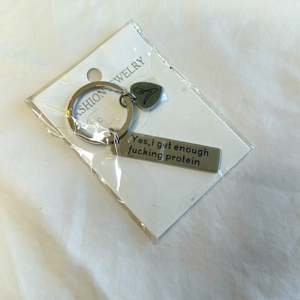 NEW WITH TAGS!! Vegetarian key chain reads “Yes, I get enough f***ing protein”